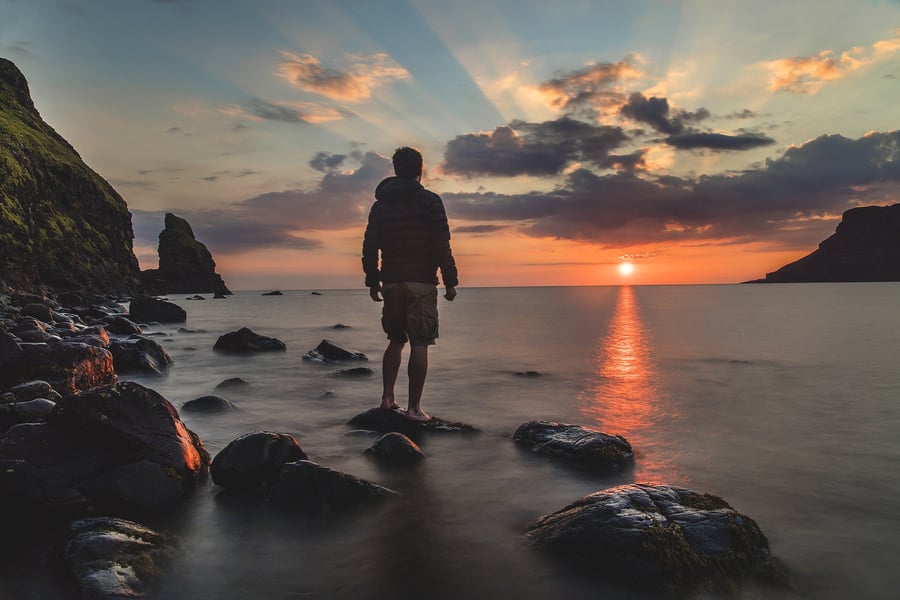 A Traveler Enjoying the Sunset at the Beach